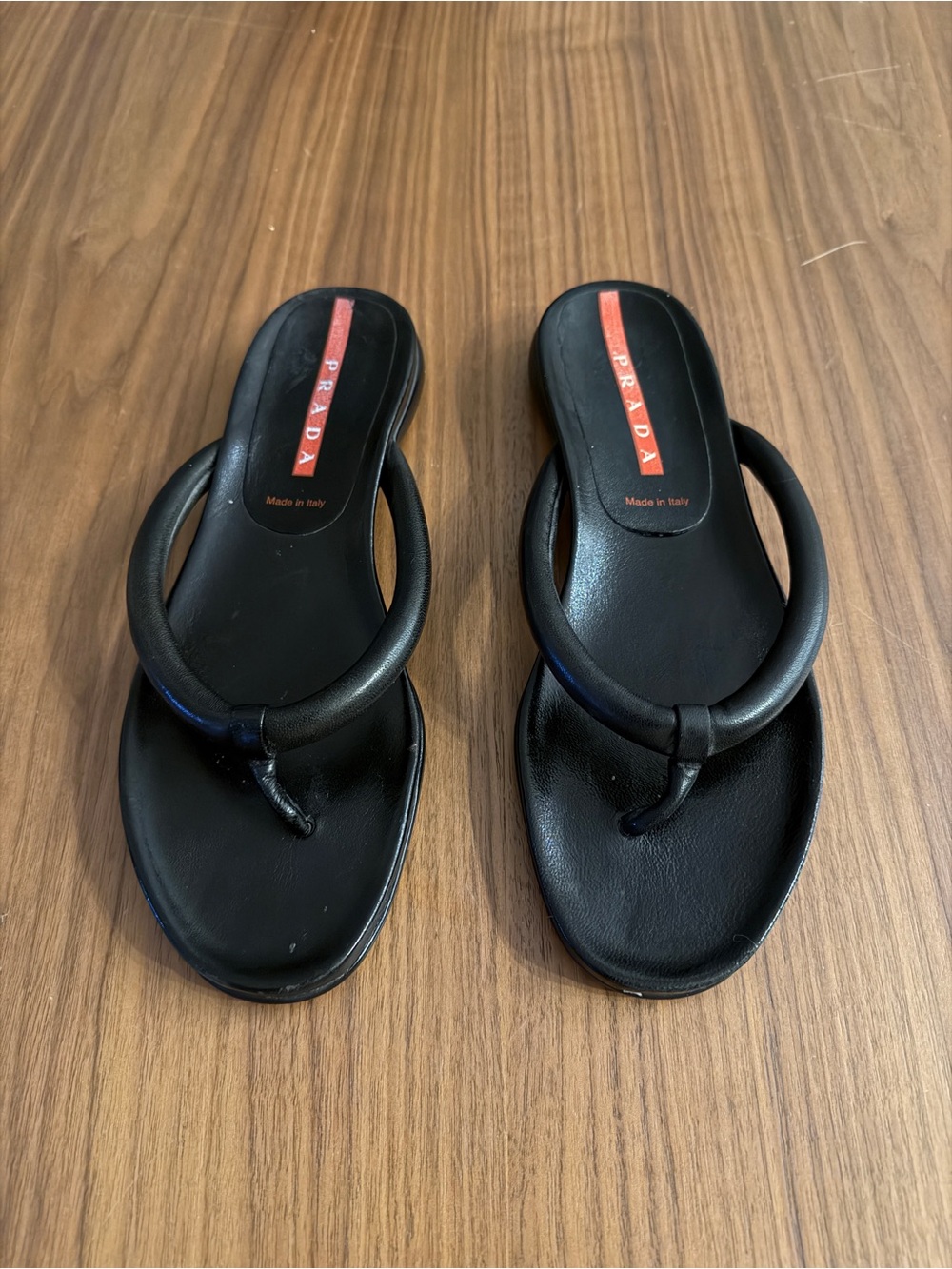 Prada Black Leather Loop-Top Toe-Post Sandals with Red Logo Inlay